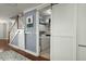 Convenient laundry room with modern appliances, shelving, and a sliding barn door at 107 Nutmeg Way, Summerville, SC 29485