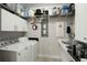 Functional laundry room featuring a sink, modern washer and dryer, and ample storage at 107 Nutmeg Way, Summerville, SC 29485