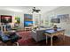 Comfortable living room with a cozy sectional, large windows for natural light, and a statement art piece at 107 Nutmeg Way, Summerville, SC 29485