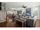 Open-concept living space with hardwood floors seamlessly connecting the living room and kitchen at 107 Nutmeg Way, Summerville, SC 29485