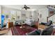 Inviting living room with a cozy sectional, area rug, and a vintage-style fan at 107 Nutmeg Way, Summerville, SC 29485