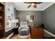 Home office with a comfortable recliner, wood desk, and unique decor at 107 Nutmeg Way, Summerville, SC 29485