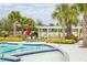 Zero entry kid-friendly pool with palm trees, landscaping, and comfortable seating at 107 Nutmeg Way, Summerville, SC 29485