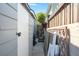 Narrow side yard with a utility shed and privacy fence, providing secure storage and a defined boundary at 107 Nutmeg Way, Summerville, SC 29485