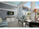 Cozy sunroom with comfortable seating, a ceiling fan, and natural light from the surrounding windows at 107 Nutmeg Way, Summerville, SC 29485