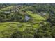 Aerial view of a golf course community surrounded by lush greenery and waterways at 1153 Summerwind Ln, Seabrook Island, SC 29455