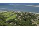 Aerial view showcases the community featuring golf course, residential area and ocean views at 1153 Summerwind Ln, Seabrook Island, SC 29455