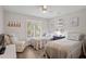 Bright bedroom featuring twin beds, a window with shutters, and tasteful decor at 1153 Summerwind Ln, Seabrook Island, SC 29455