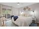 Calm bedroom with king bed, coastal decor, and sliding door with access to the screened patio at 1153 Summerwind Ln, Seabrook Island, SC 29455