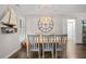 Bright dining area featuring a large clock and beachy nautical decor at 1153 Summerwind Ln, Seabrook Island, SC 29455