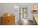 Cozy dining area featuring a wooden cabinet, nautical decor and wood flooring at 1153 Summerwind Ln, Seabrook Island, SC 29455
