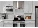 White cabinets, stainless steel appliances, and light countertops make this kitchen very desirable at 1153 Summerwind Ln, Seabrook Island, SC 29455