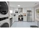 Bright, updated kitchen with stainless steel appliances and white cabinetry at 1153 Summerwind Ln, Seabrook Island, SC 29455