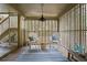Covered patio features a striped rug and seating area with chairs and table at 1153 Summerwind Ln, Seabrook Island, SC 29455