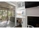 Living room workspace with fireplace and screened-in patio views at 1153 Summerwind Ln, Seabrook Island, SC 29455