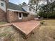 Brick patio by the house with a trimmed lawn in the backyard at 116 W Johnston St, Summerville, SC 29483