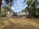 Large backyard with a brick patio and house at 116 W Johnston St, Summerville, SC 29483