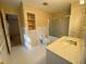 Bathroom with white fixtures, including a single vanity, bathtub, and toilet at 116 W Johnston St, Summerville, SC 29483