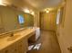 A bathroom has a large vanity with dual sinks and plenty of storage space at 116 W Johnston St, Summerville, SC 29483