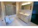 Bathroom featuring a bathtub/shower combination, single sink vanity and white hexagon tile at 116 W Johnston St, Summerville, SC 29483