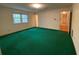 Large bedroom featuring natural light and green carpet at 116 W Johnston St, Summerville, SC 29483