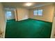 Spacious bedroom with multiple windows and green carpet at 116 W Johnston St, Summerville, SC 29483