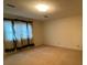 Bedroom with carpet, window, and curtains at 116 W Johnston St, Summerville, SC 29483