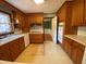 Efficient kitchen with classic cabinetry, modern appliances, and white tile floor, offering a timeless design at 116 W Johnston St, Summerville, SC 29483