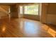 Inviting living room with hardwood floors, large bay window, and classic trim, creating a warm and comfortable space at 116 W Johnston St, Summerville, SC 29483