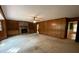 A living room highlights wood paneling, brick fireplace, and access to other rooms at 116 W Johnston St, Summerville, SC 29483