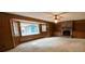 A living room showcases a brick fireplace, built-in bookshelves, and a bay window at 116 W Johnston St, Summerville, SC 29483