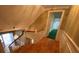 Upper staircase landing with natural hardwood floors and white wooden railing at 116 W Johnston St, Summerville, SC 29483