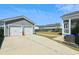 Exterior image showcasing the garage, patio and screened-in porch in fenced yard at 123 Hewitt St, Summerville, SC 29486