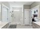 Modern bathroom with glass-enclosed shower, double vanities, and tiled floors at 123 Hewitt St, Summerville, SC 29486