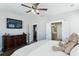 Spacious bedroom features a TV, dresser, ceiling fan, and ensuite bathroom for added convenience at 123 Hewitt St, Summerville, SC 29486