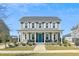 Charming two-story home featuring a welcoming front porch and a vibrant blue front door at 123 Hewitt St, Summerville, SC 29486