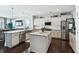 Spacious kitchen featuring marble countertops, stainless steel appliances, and a central island at 123 Hewitt St, Summerville, SC 29486