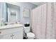Light and airy bathroom with decorative shower curtain, single sink and toilet at 124 Gaura Ln, Summerville, SC 29483