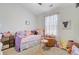 Cozy bedroom with plush decor, window, and ceiling fan at 124 Gaura Ln, Summerville, SC 29483