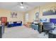 Spacious bonus room or office area with ample lighting, a comfortable sofa, and workspace at 124 Gaura Ln, Summerville, SC 29483