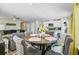 Dining area with seating for four, adjacent to the kitchen and living spaces at 124 Gaura Ln, Summerville, SC 29483