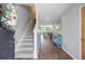 Welcoming entryway featuring hardwood floors and stairway, flowing to living area at 124 Gaura Ln, Summerville, SC 29483
