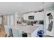 Open kitchen view featuring a large island with a sink, stainless appliances, and white cabinets at 124 Gaura Ln, Summerville, SC 29483