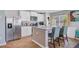Bright kitchen with stainless steel appliances, an island with seating, and white cabinetry at 124 Gaura Ln, Summerville, SC 29483