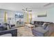 Bright and comfortable living room with large sectional and soft colors and decor at 124 Gaura Ln, Summerville, SC 29483
