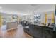 Open concept living room with modern decor and plenty of light with access to kitchen at 124 Gaura Ln, Summerville, SC 29483