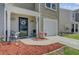 Cozy porch with seating, stylish wreath, and charming landscaping in a pleasant setting at 124 Gaura Ln, Summerville, SC 29483