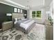 Spacious main bedroom with a decorative ceiling, an elegant chandelier, and a large window at 124 Royal Cainhoy Way, Huger, SC 29450