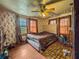 Bedroom with wood floors, a ceiling fan, a queen-sized bed, and natural light at 1393 Russellville Rd, Saint Stephen, SC 29479