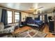 A comfortable bedroom features a ceiling fan, wood-style floor, and a lounge chair at 1393 Russellville Rd, Saint Stephen, SC 29479
